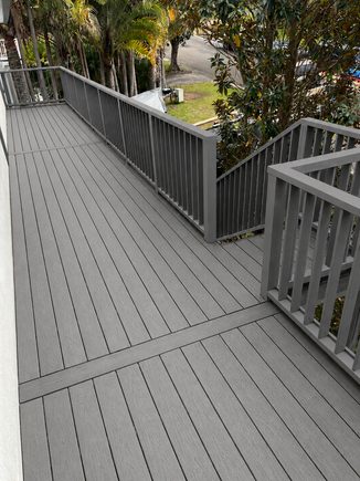 Elevated grey composite deck with balustrade