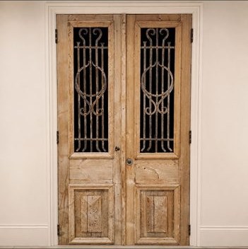 Timber double doors with wrought iron glazing