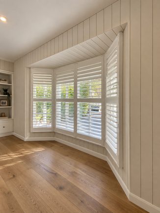 Panelled bay window feature wall with shutters