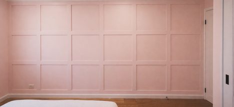 Pink panelled bedroom wall