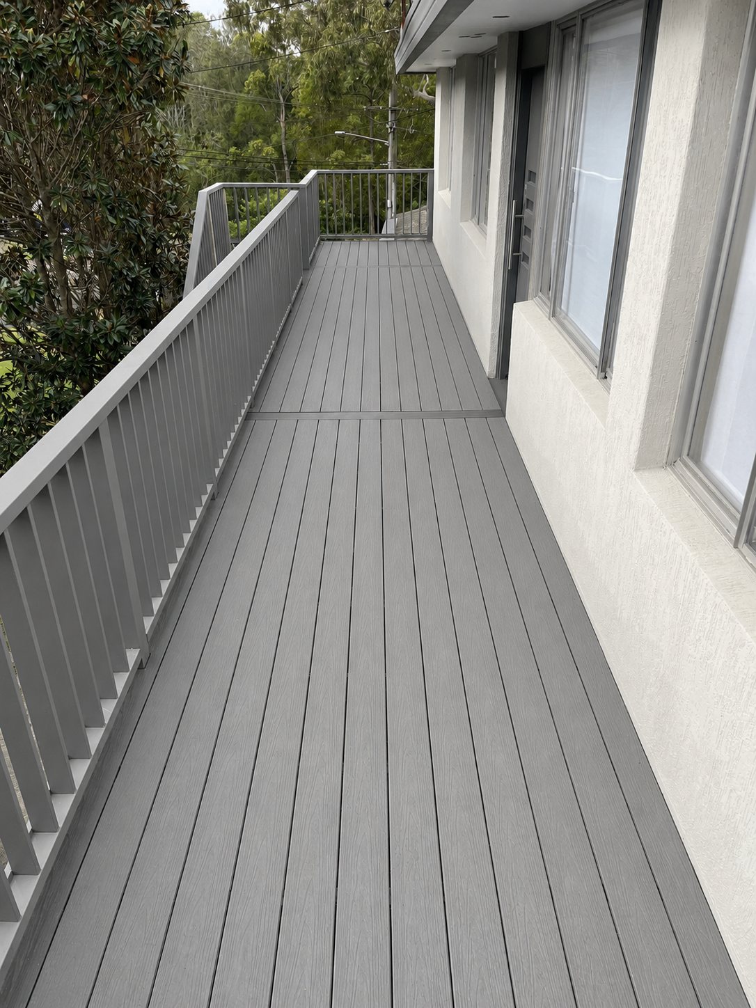 Grey composite balcony deck with aluminium balustrade