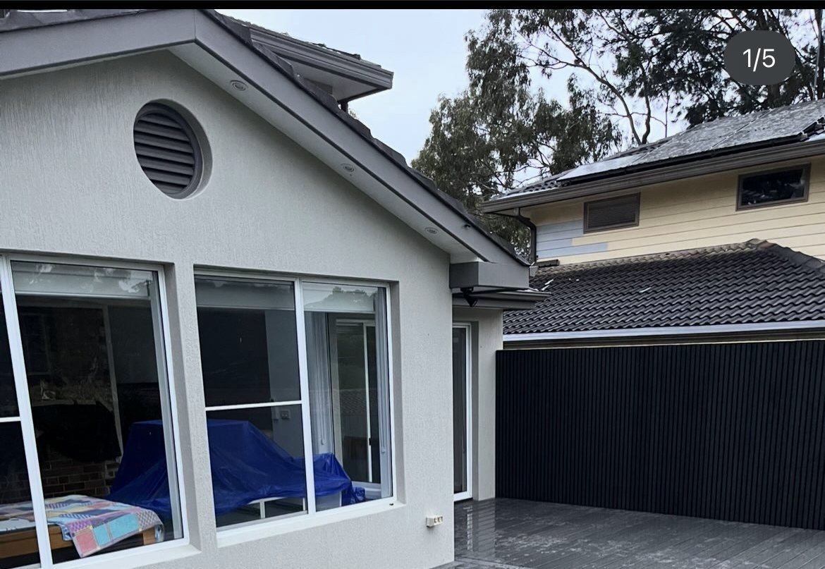 Grey composite deck, house exterior