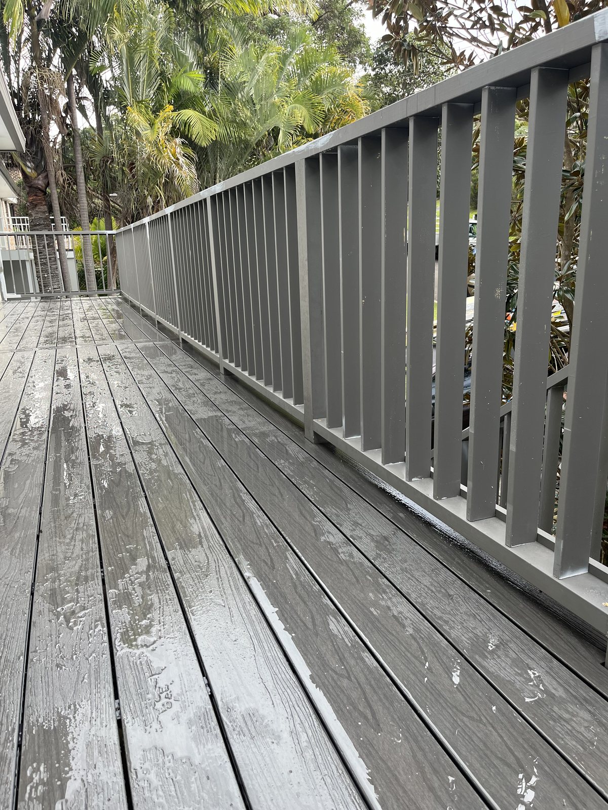 Grey composite deck with matching slat balustrade