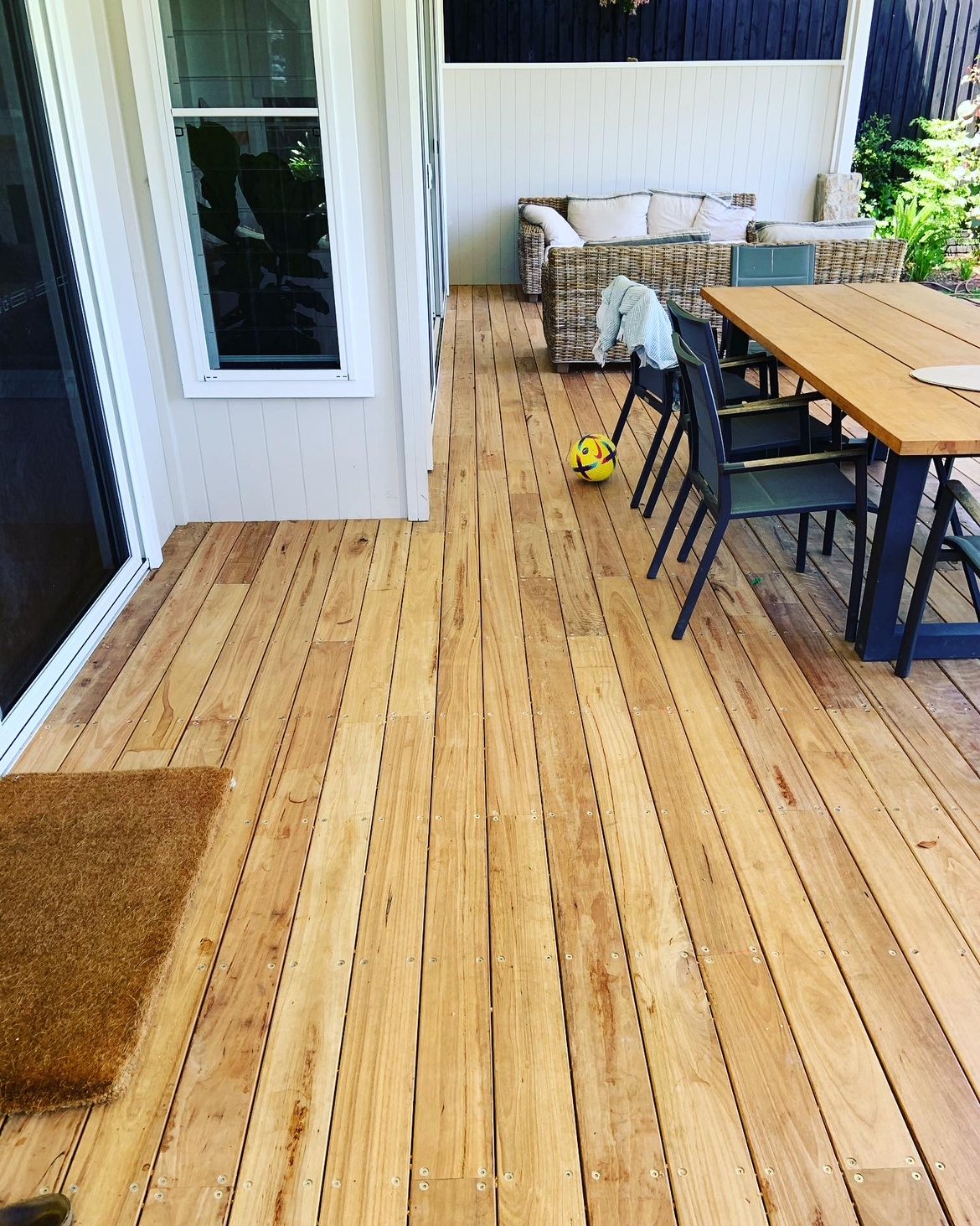 Finished deck with outdoor lounge and dining setting