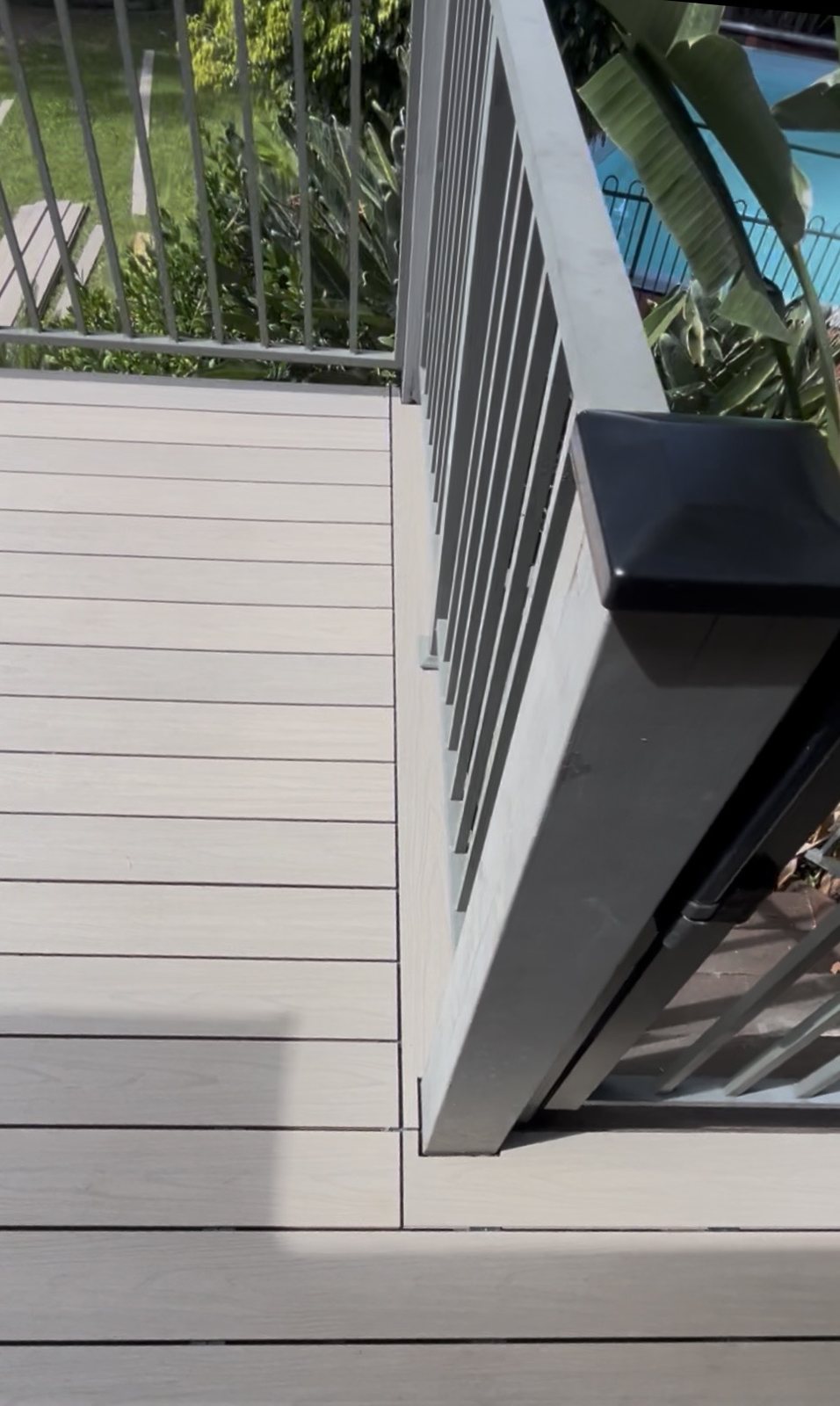 Composite deck and balustrade detail beside a pool