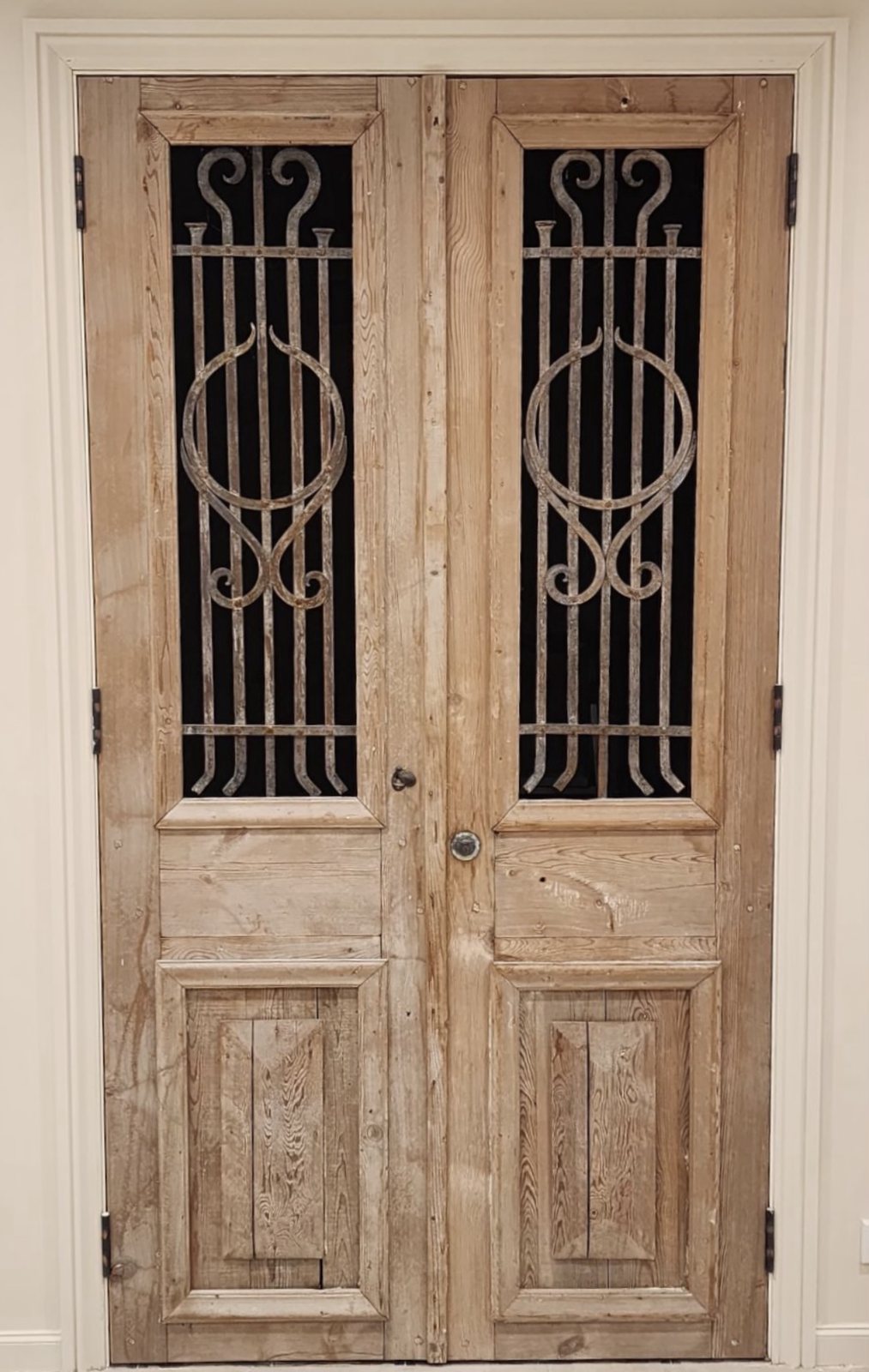 Antique timber double door with wrought iron inserts