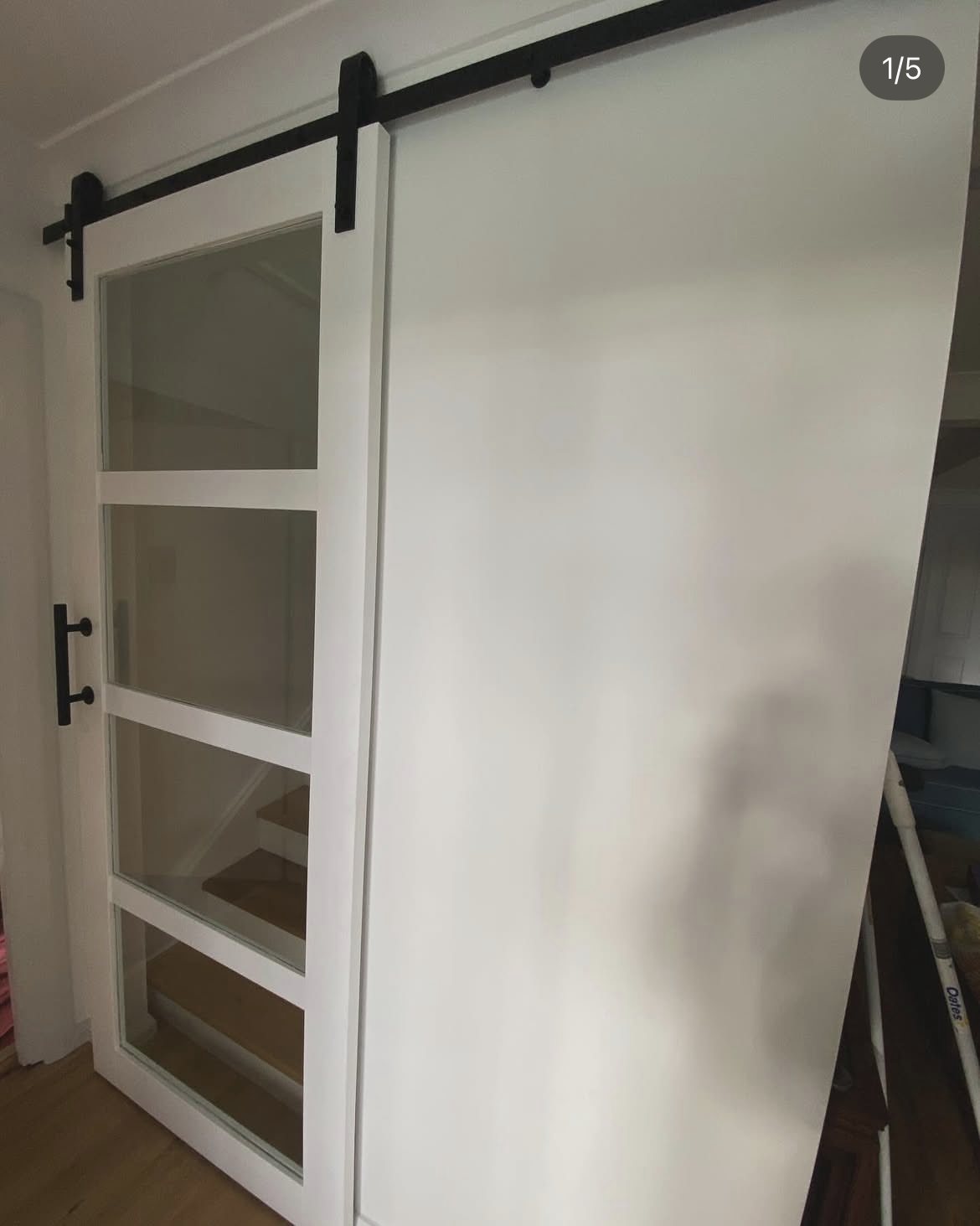 White sliding barn door with glass panel