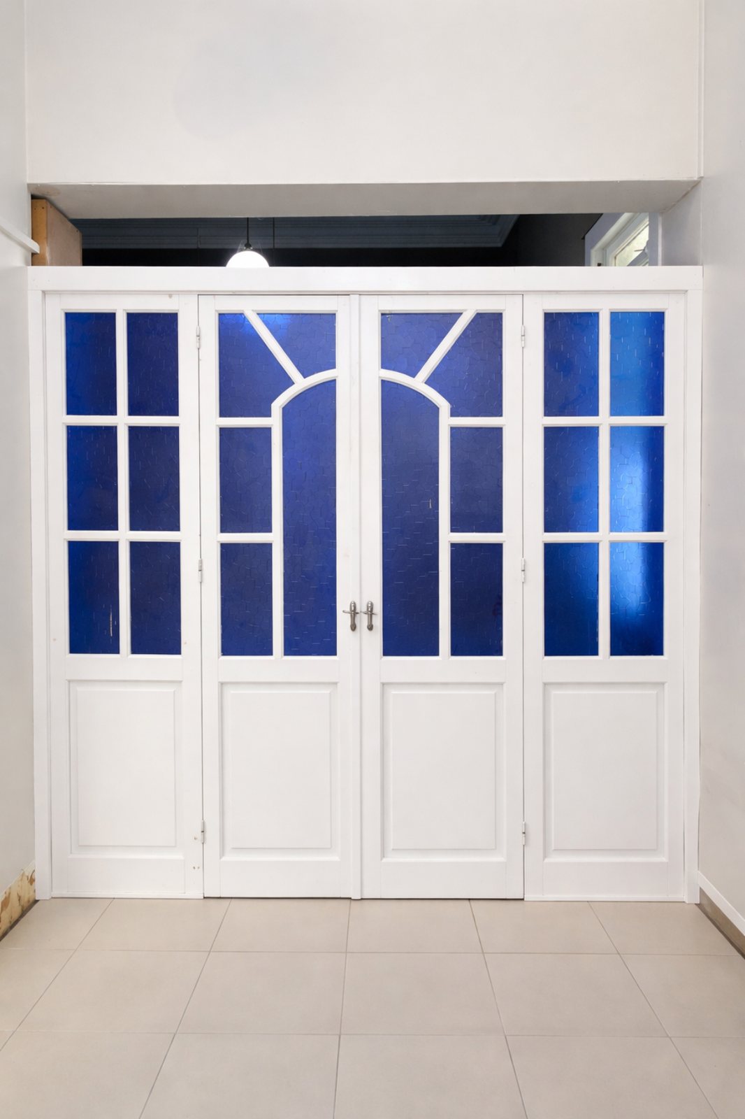 White door with blue stained glass panels