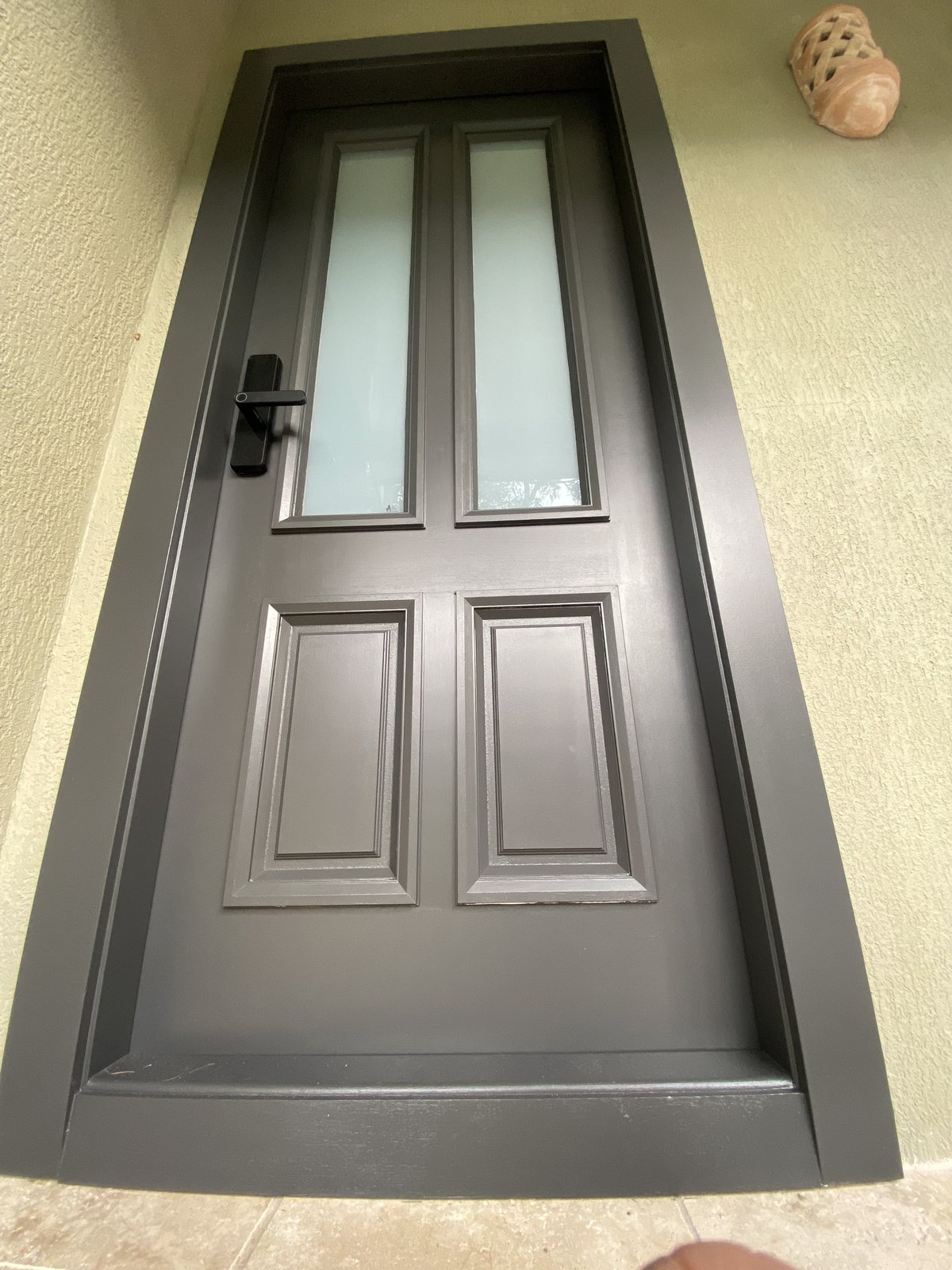 Charcoal front door, alternate angle in daylight