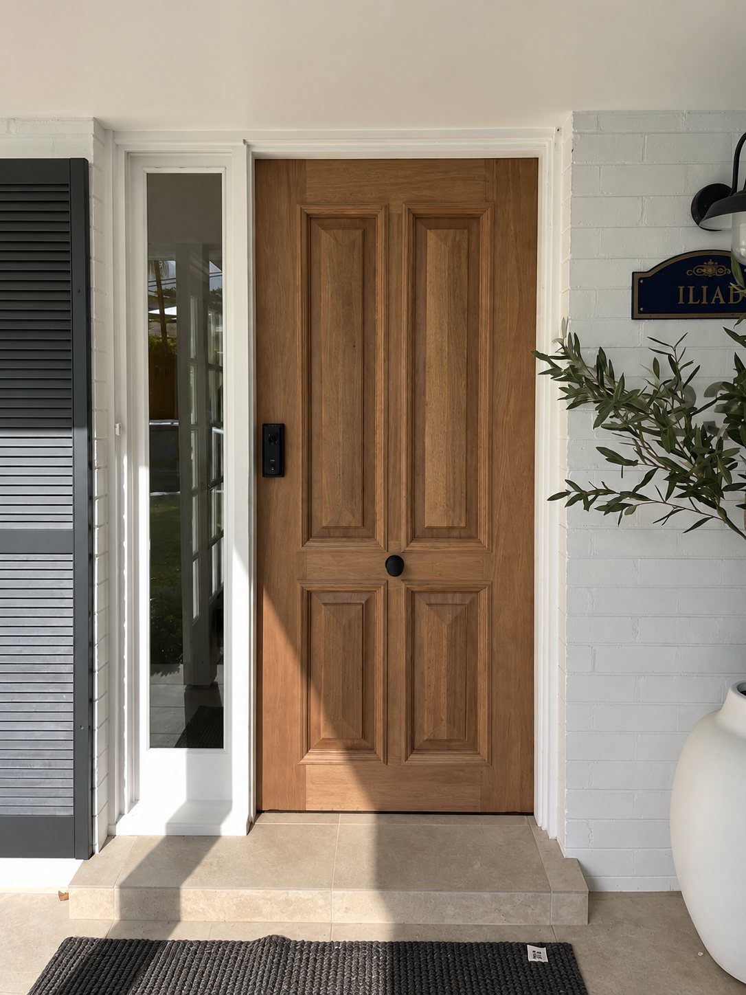 Timber panelled door with brass hardware