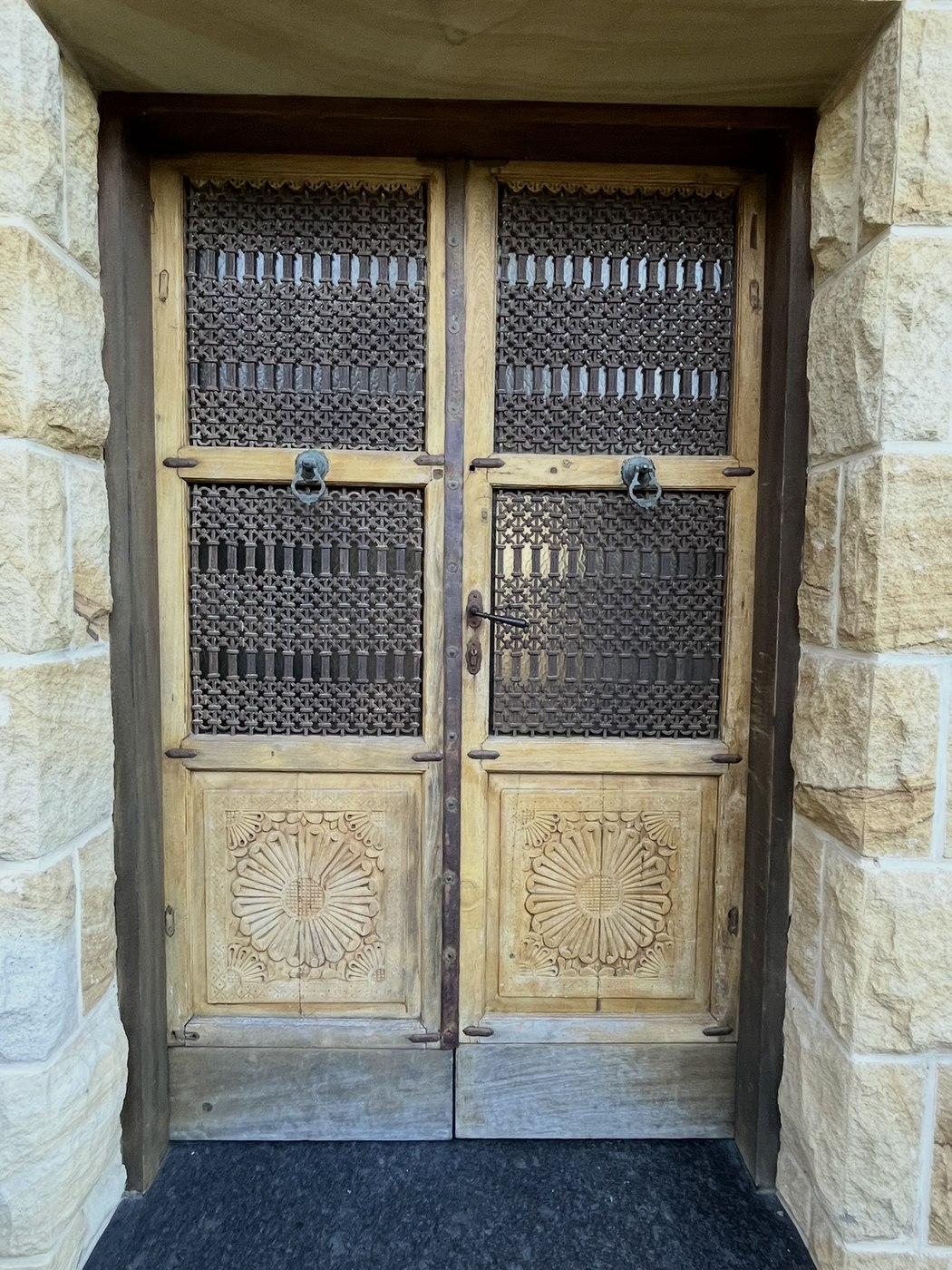 Before: ornate carved timber double doors