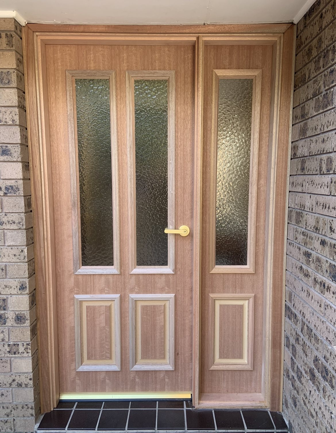 Timber double door with sidelight and gold handle