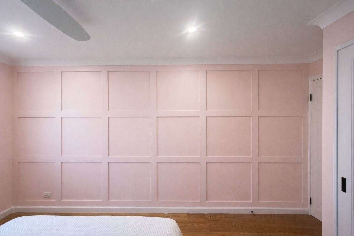 Pink panelled feature wall in a bedroom