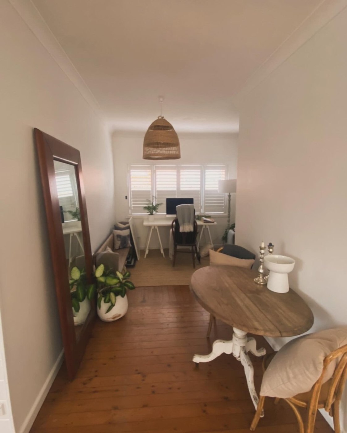 Before: office nook with mirror and round table