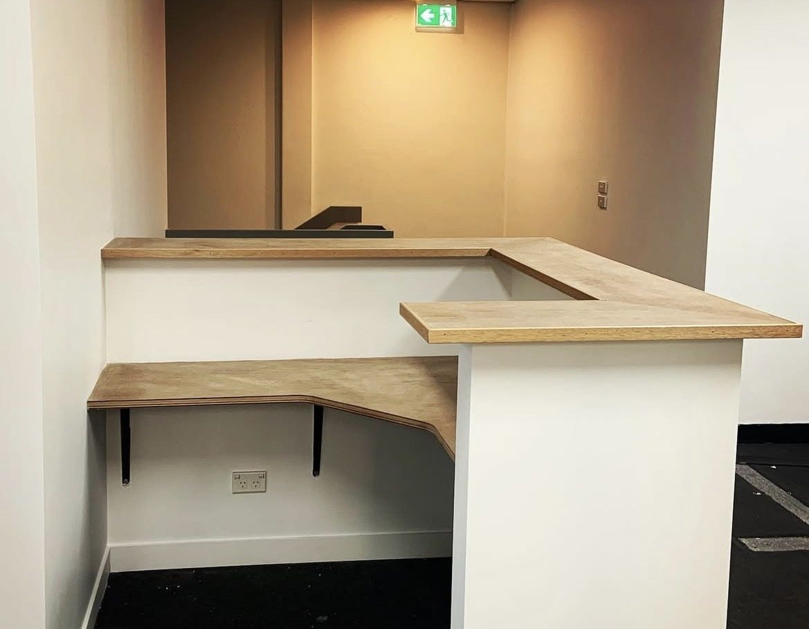 Custom reception desk under construction, angle A
