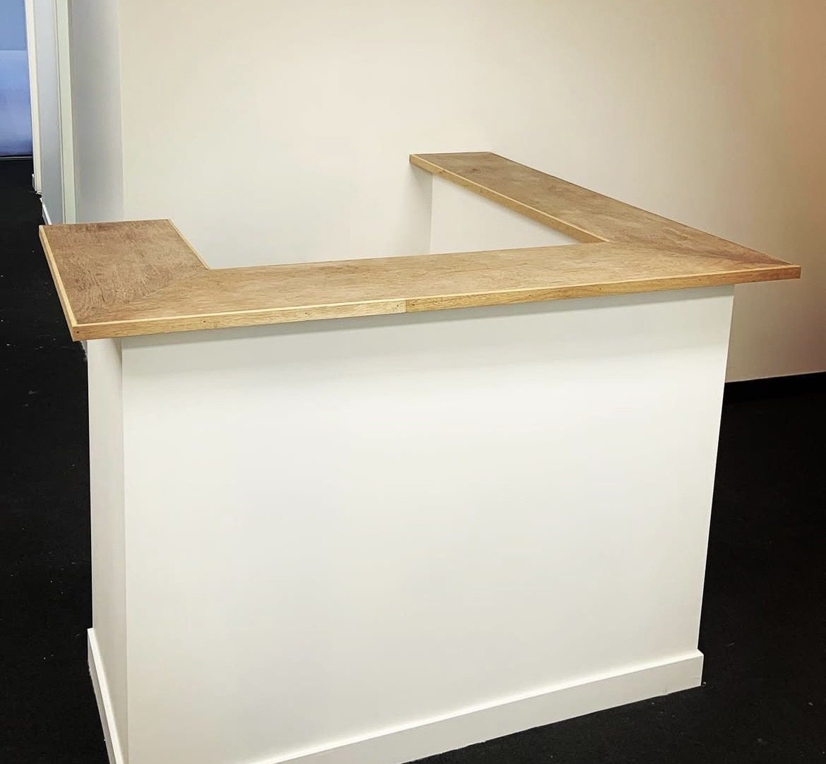 Custom reception desk under construction, angle B