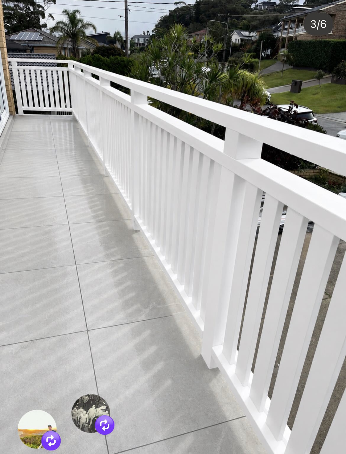 White balustrade balcony with coastal view