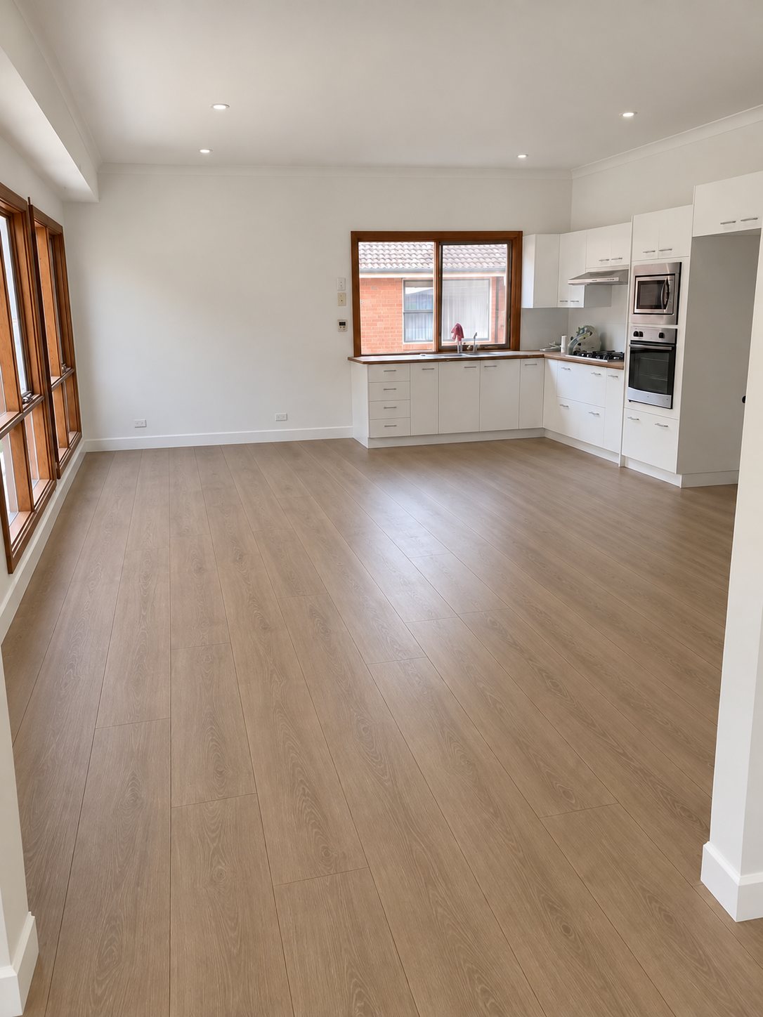 Renovated open-plan kitchen and living space, new flooring