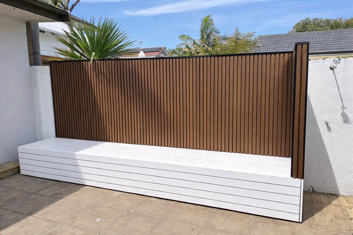 Timber slat privacy screen above a built-in storage bench