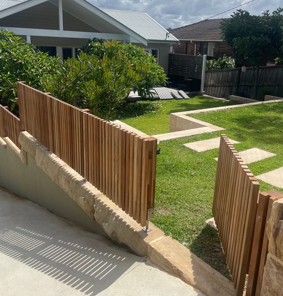Timber privacy screening along a side pathway