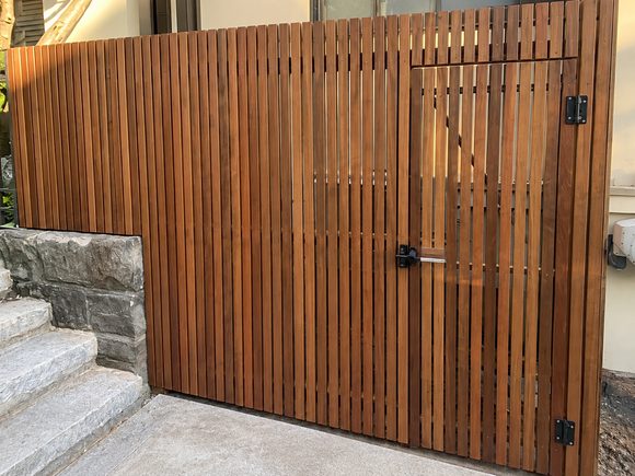 Timber batten gate at the top of stone steps
