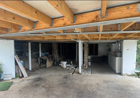 Before: garage with exposed timber beams
