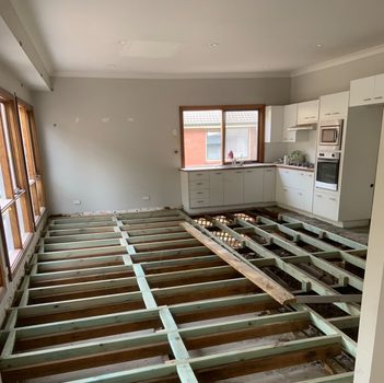 Before: exposed floor joists
